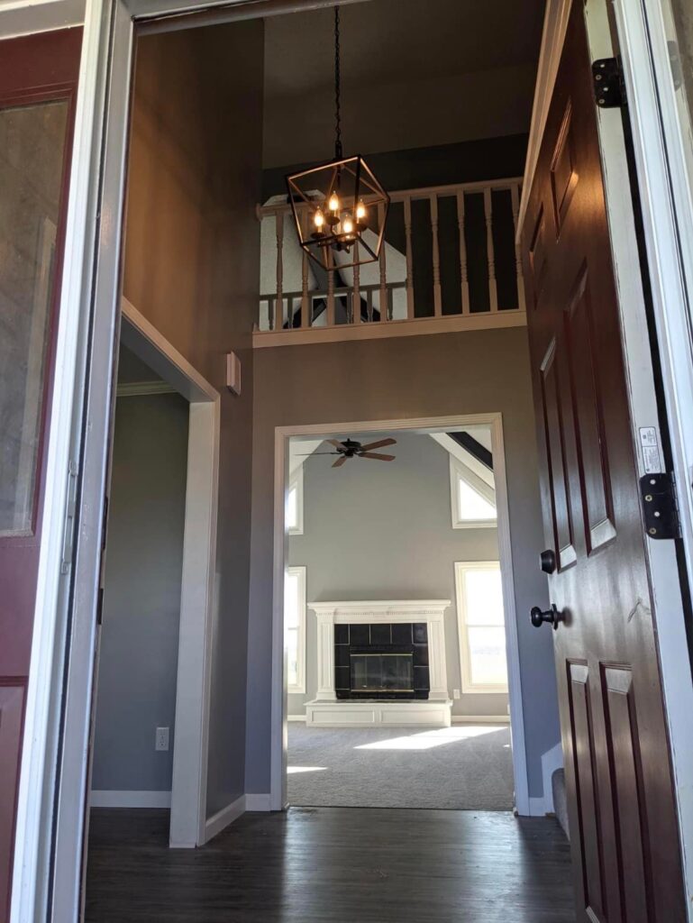 Renovated great room with vaulted ceiling and fireplace